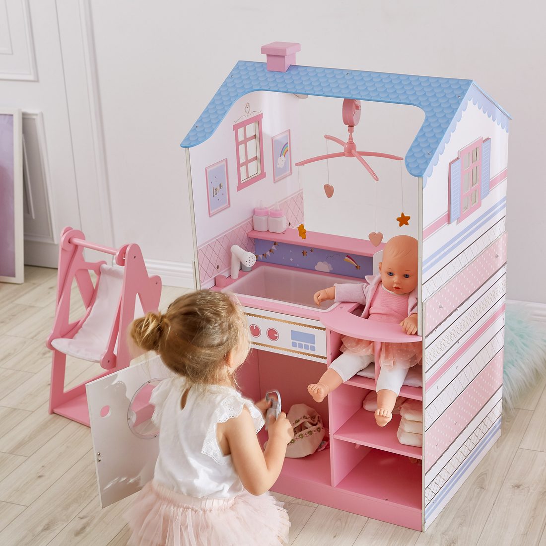 Wooden doll nursery center in a playroom