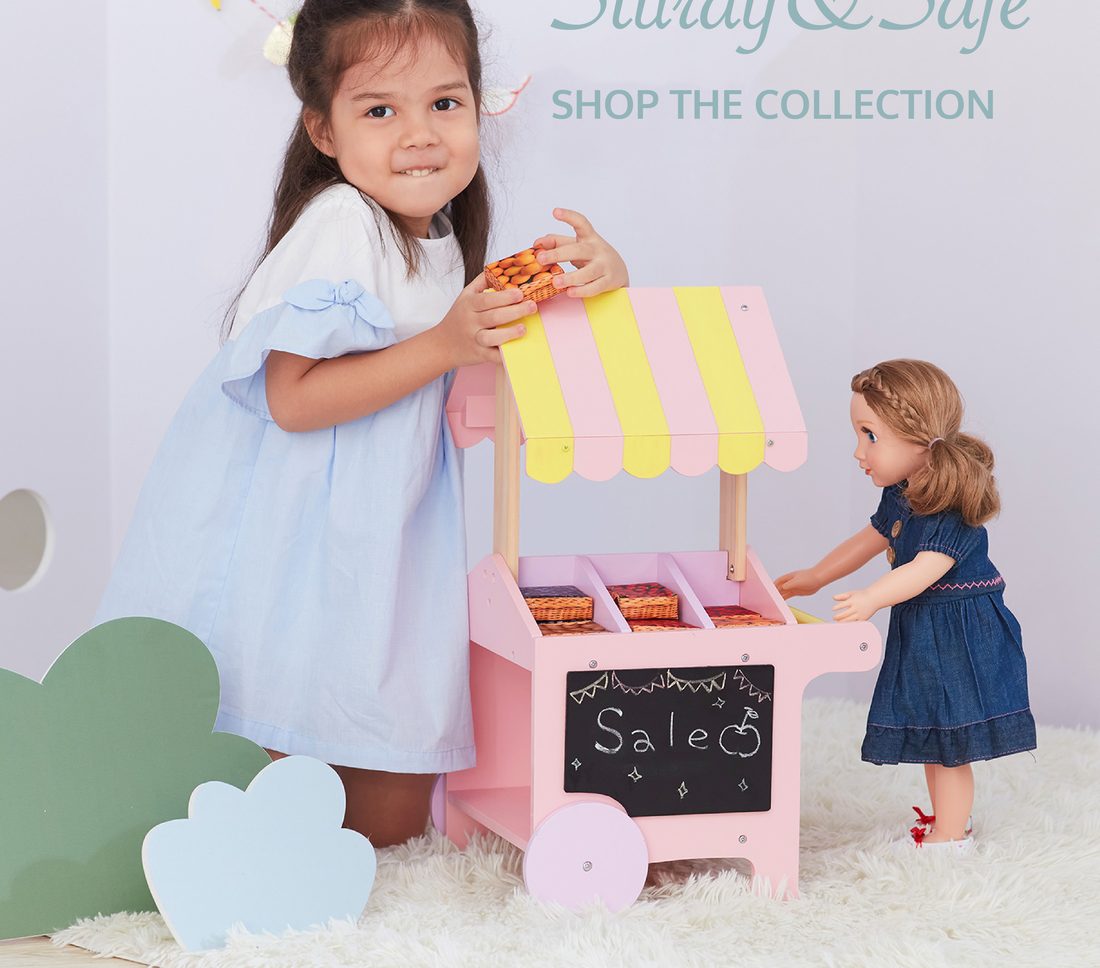Girl playing with a doll pastry cart